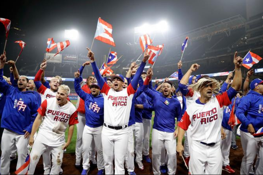 Second baseman of Puerto Rico, Javier Baez (R) makes Yurendell de